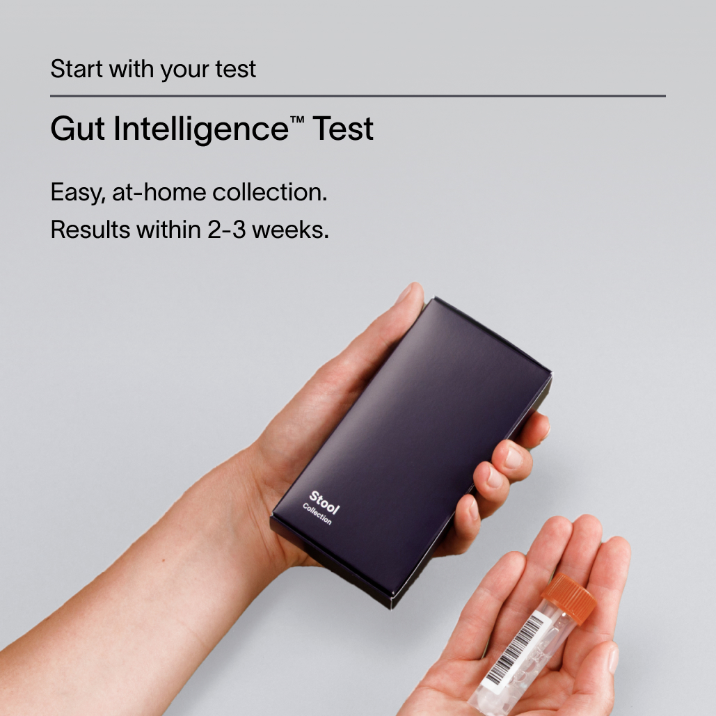 A dark gray text block describing the Viome Gut Intelligence Test, all placed over an image of two hands holding a saliva sample and test tube