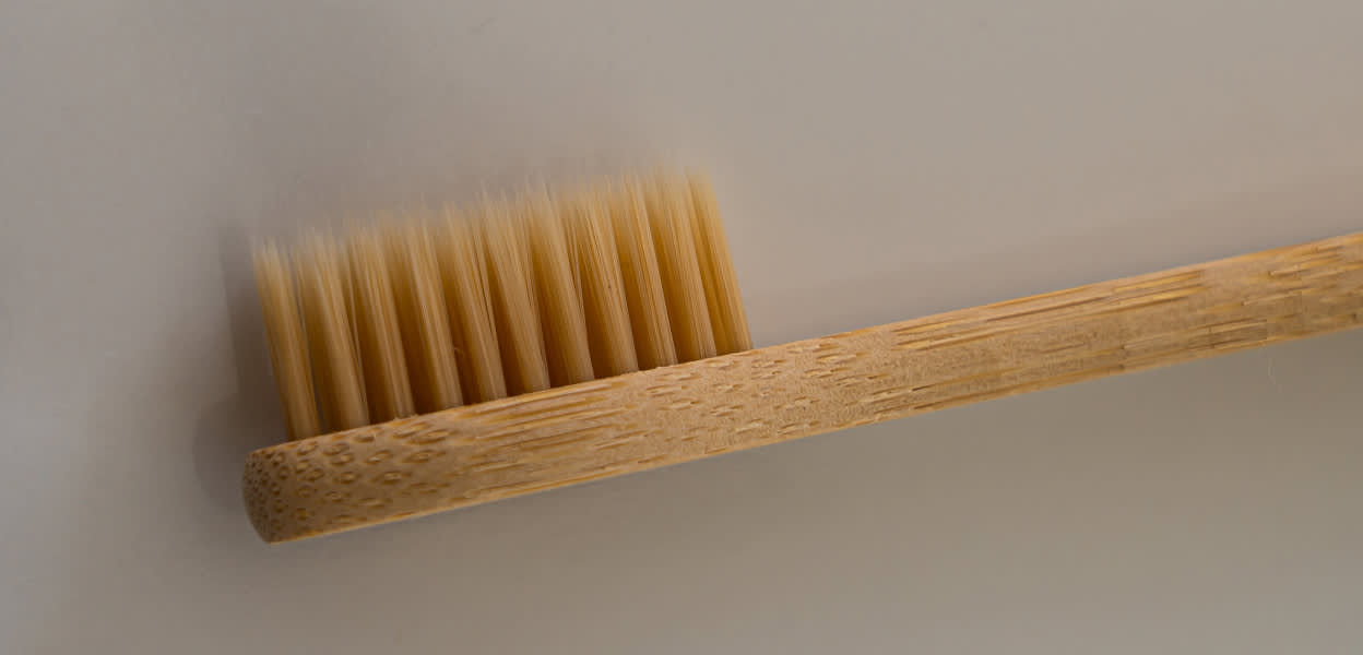 A close-up of a wooden toothbrush – Viome Oral Health Intelligence Test 