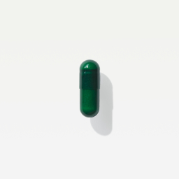 A close-up shot of a green Viome Precision Supplement capsule 